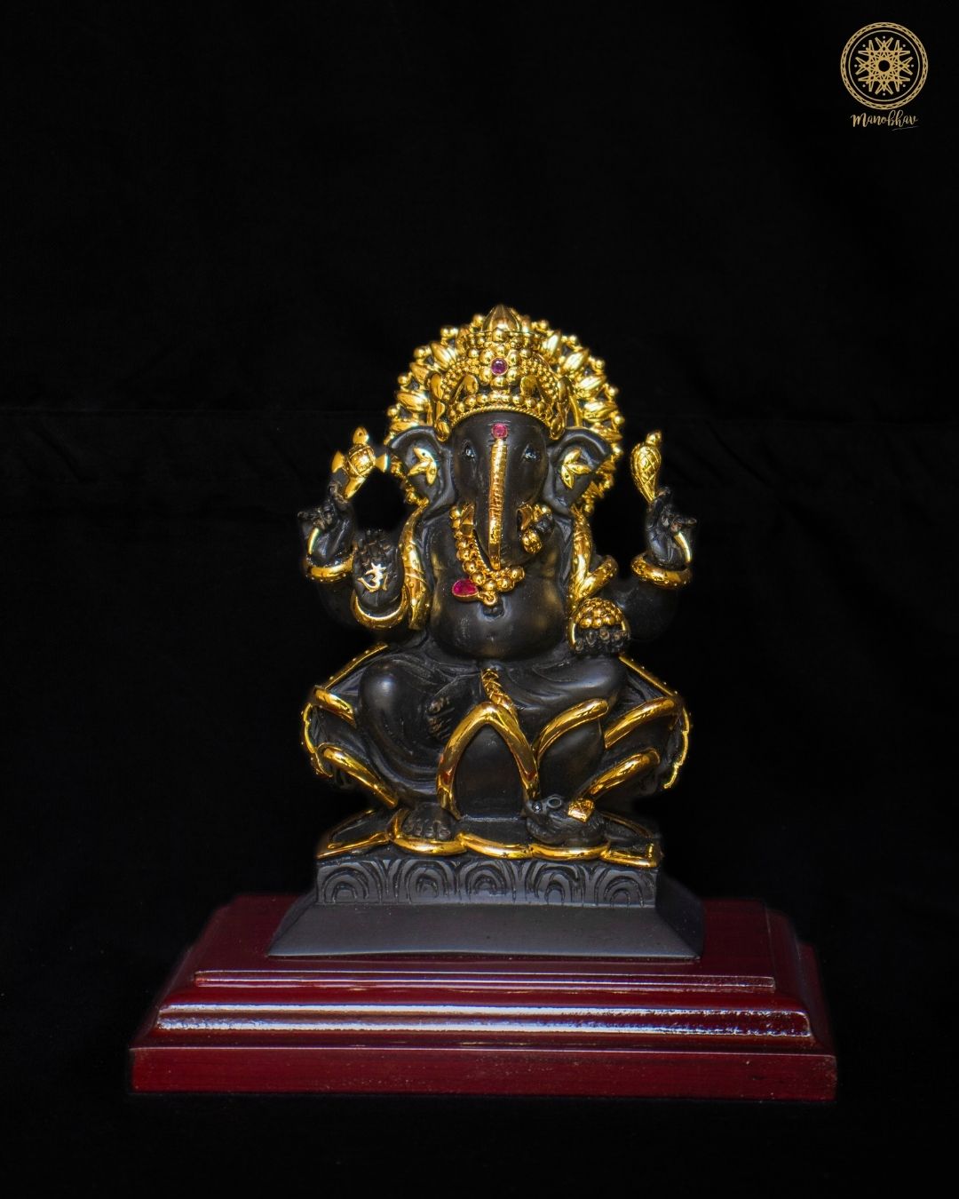 Black Lord Ganesha Idol with Lotus Base and Gold-Plated Jewelry