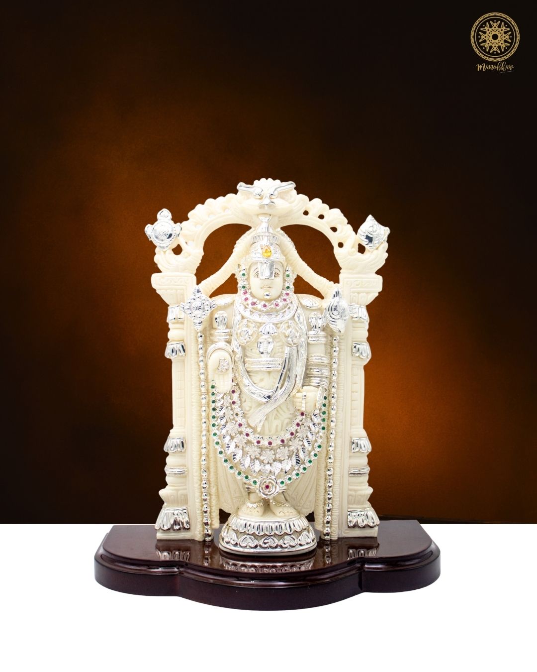 Tirupati Balaji with silver jewelry on a highly polished wooden base 